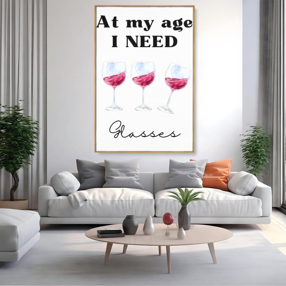 Tablou canvas cu tablou canvas cu pahare de vin si mesaj, in rama de aluminiu auriu, pe perete intr-un living